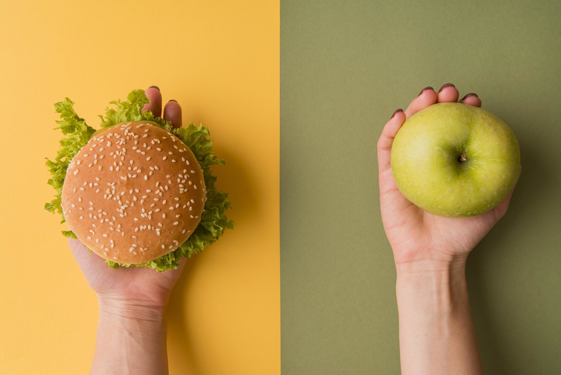 top view hands holding burger apple